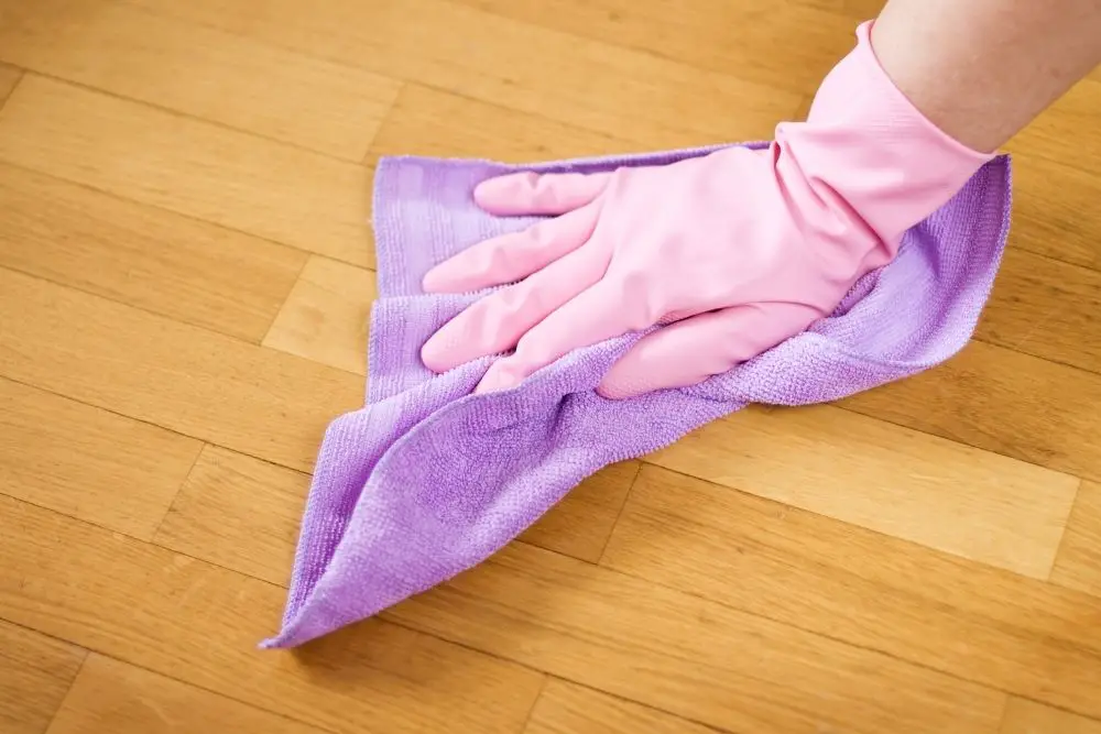 Cleaning the floor with a rag